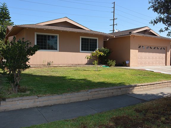 Front lawn with shrub fence