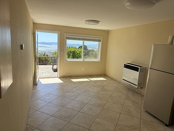 Looking from bedroom into main room...can see patio and view
refrigerator is brand new and quiet