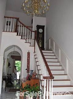 Foyer with Grandfather Clock niche
						:
						Note the arched entrance to Great Room. Main level has 10 foot celings