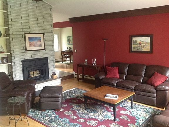 Living Room
						:
						Sunken Living room with Jotul wood-burning fireplace insert, hardwood floors.
