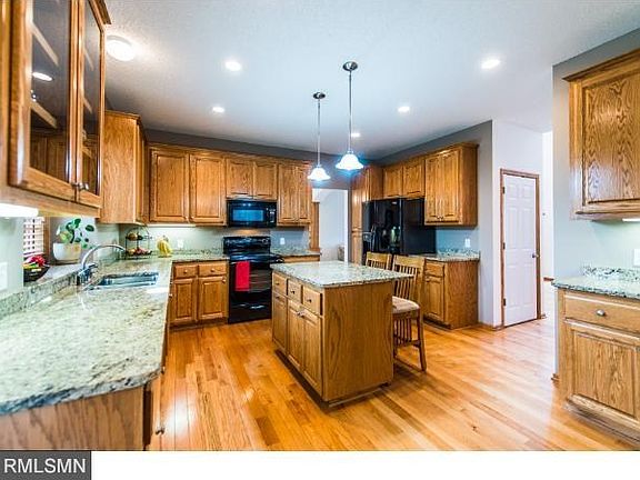 Large kitchen boasts hardwood floors and granite countertops.  Center island for prepping dinner.