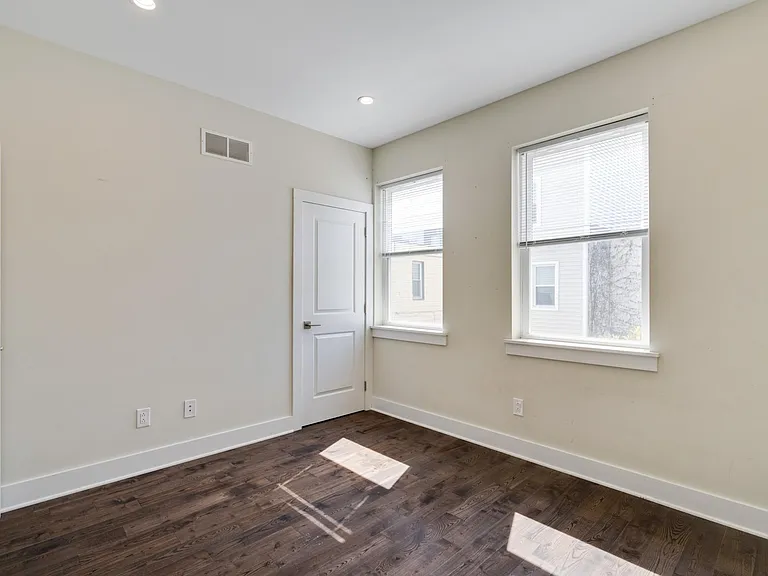 Door is a walk-in closet which goes the length of the room