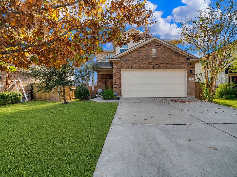 House front yard and driveway view. 2-car garage