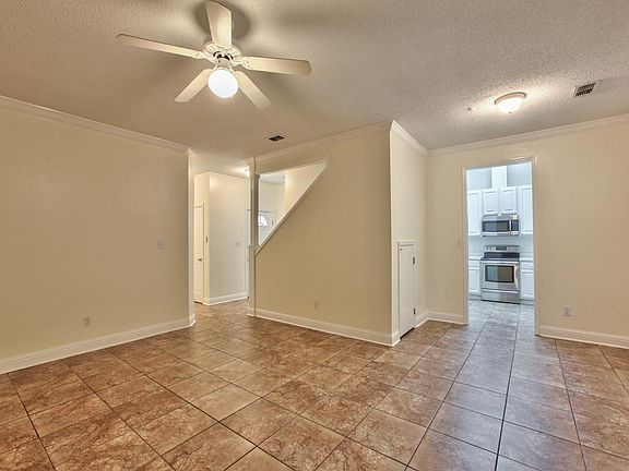 Living Room to Dining area to Kitchen and Foyer