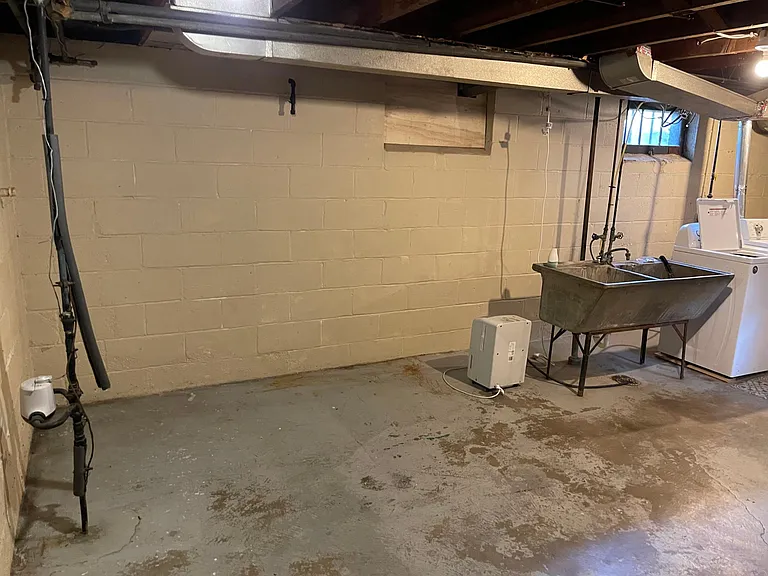 Plenty of extra storage in the basement laundry/utility room.