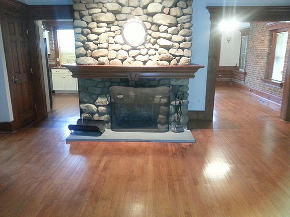 standing in living room. kitchen to left, dining room to right.