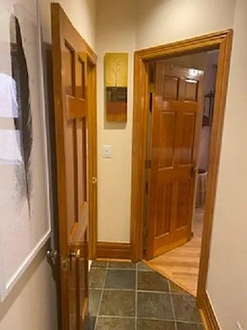 Hallway between kitchen, bedroom and bath