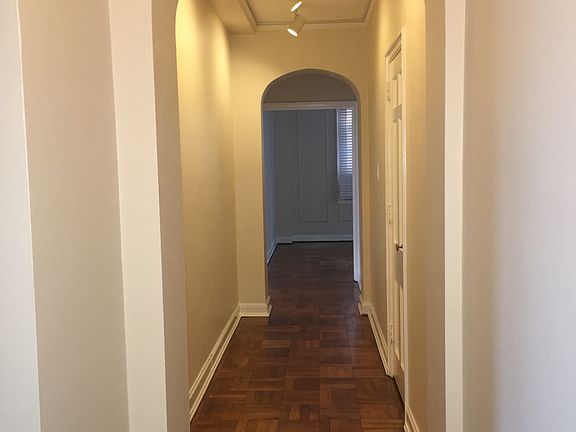High ceilings and gleaming, newly refinished floors greet yo