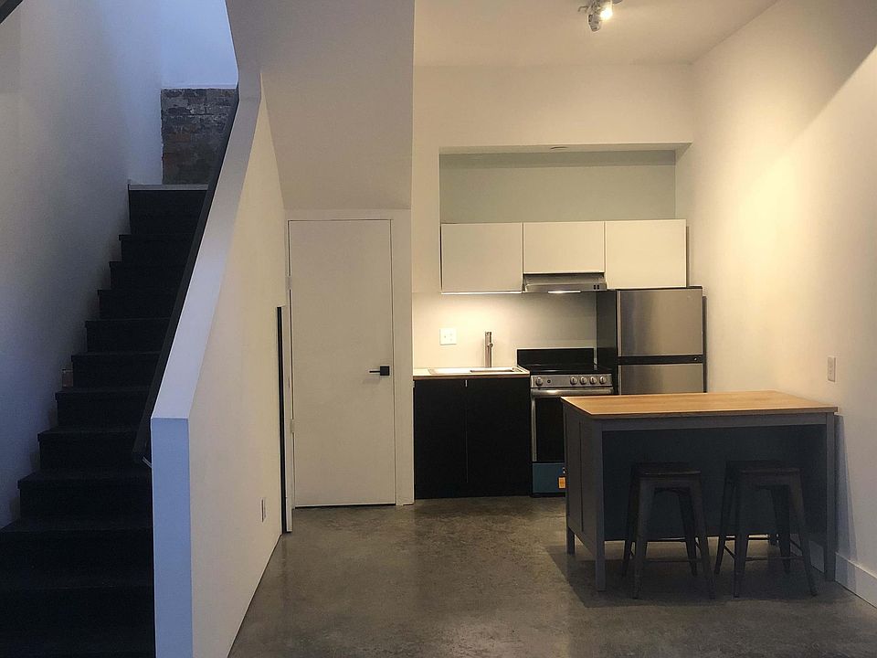 kitchen and laundry closet to the left. bar has additional storage below