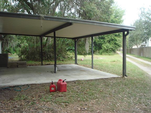 DOUBLE CARPORT LEADS TO FAMILY ROOM ENTRANCE