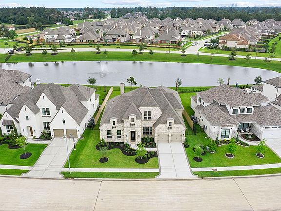Aerial view of the home. Wonderful water view of the pond and no back neighbors!