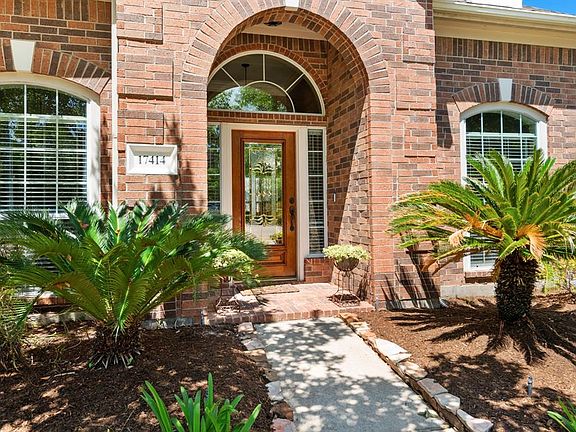The well established landscaping at the front of the home is welcoming.