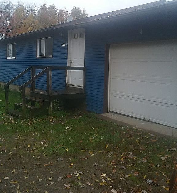 Duplex has attached garages