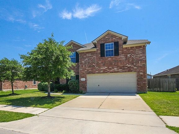 Long driveway for this 2 car garage.