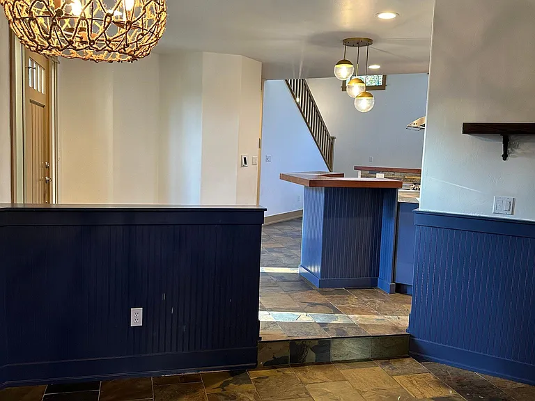 View from within dining room looking towards front entry and kitchen