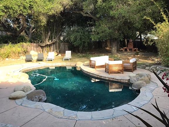 Swimming Pool and Lounge area under the large oak tree