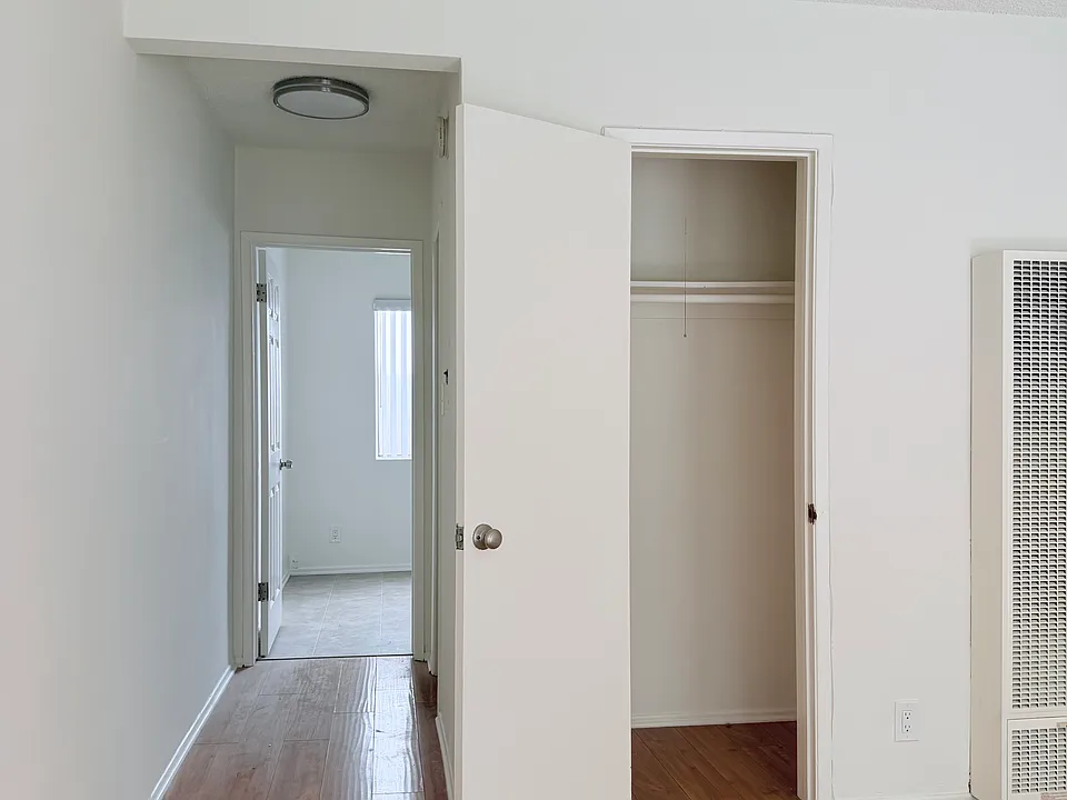 living area over looking to closet and kitchen
