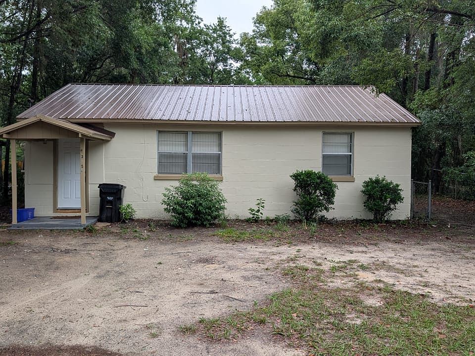 Front of house. Space for 4 cars