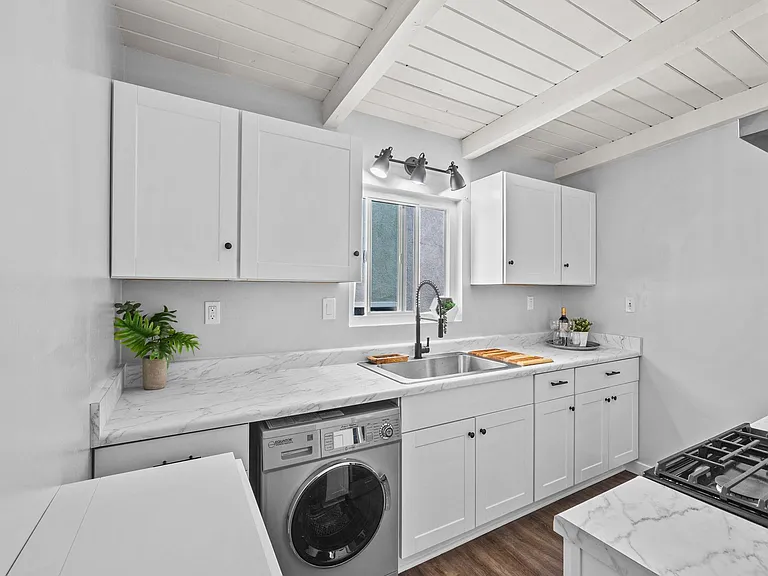 kitchen and washer/dryer combo upper level