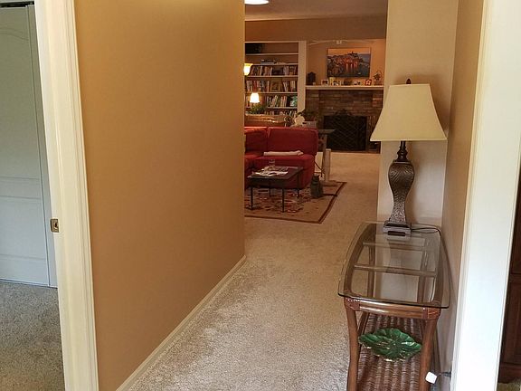 Entry hallway. To the right is the dining room. To left is "front bedroom". Straight ahead is living room.