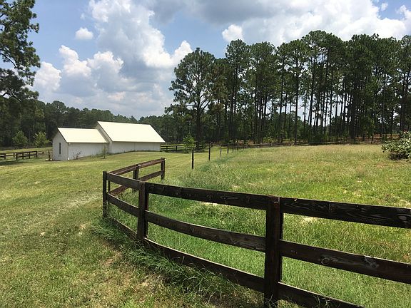 Field w two stall barn/shed