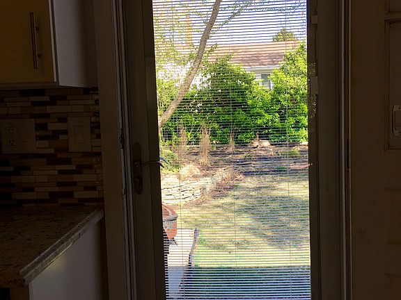 Storm door to backyard