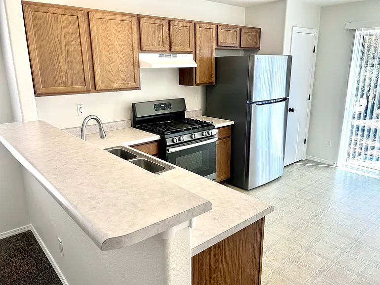 Brand new large LG refrigerator, gas stove with griddle. Plenty of cabinet space.