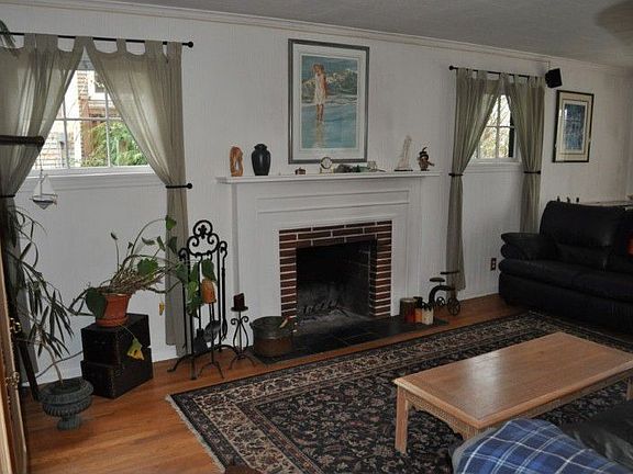 Tons of natural light, hardwood floors, wood burning fireplace.