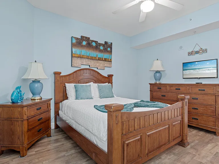 Welcome to the second guest bedroom with a queen bed.