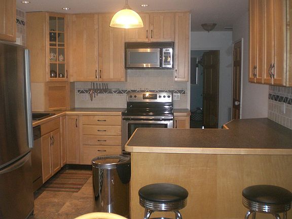 New Stainless Appliances + Tumbled Marble Backsplash