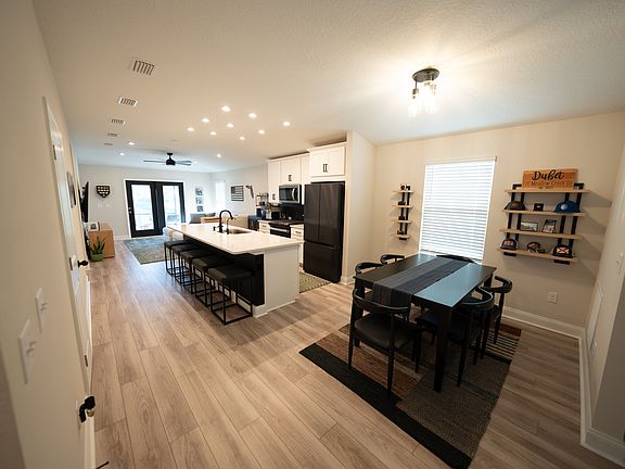 dining, kitchen, living areas