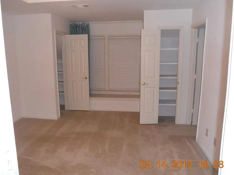 master bedroom with full bath and laundry