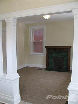 Large living room with new carpet.
