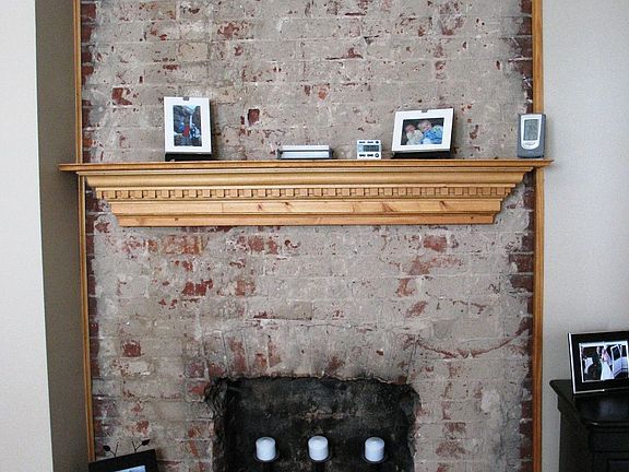 Decorative Washed Brick Fireplace Mantle in the Master