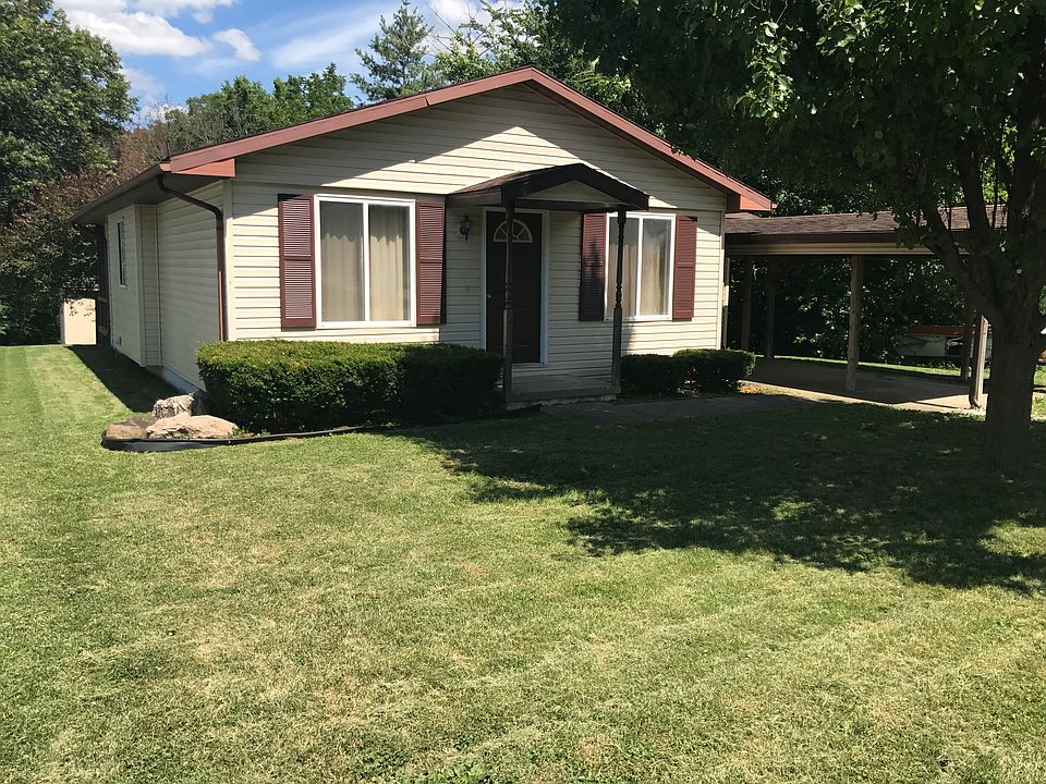 Front of house with carport