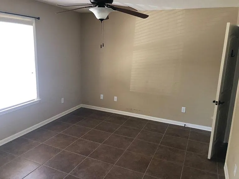Roomy bedroom with ceiling fans