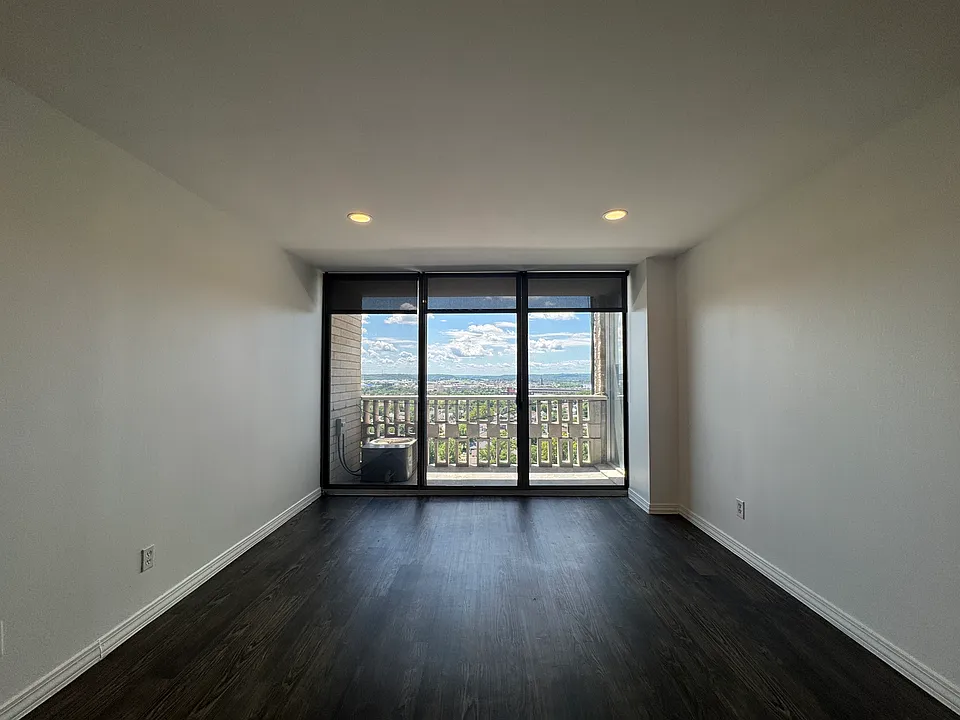 Updated living/dining room features dimmable, efficient LED lighting, new roller shades, and luxury vinyl flooring.