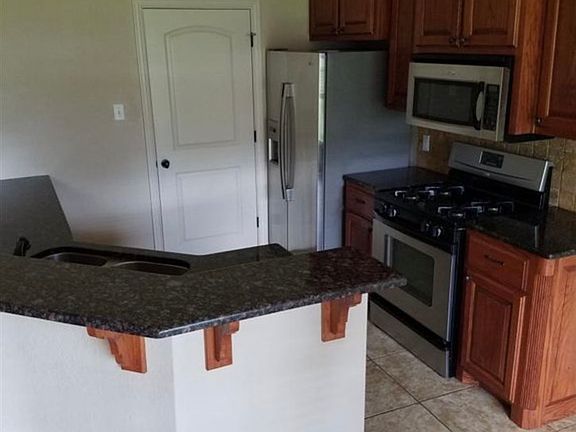 5th image of 13 NE Summerwood Dr