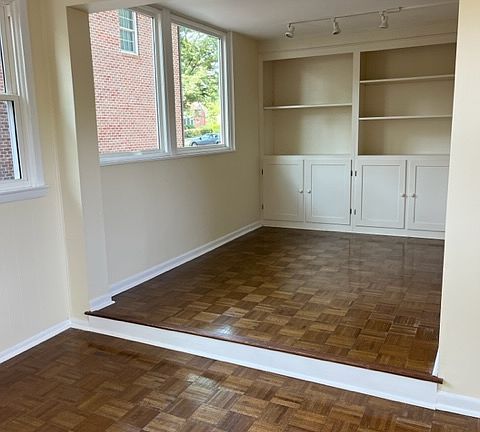 Sunroom with built-in cabinets