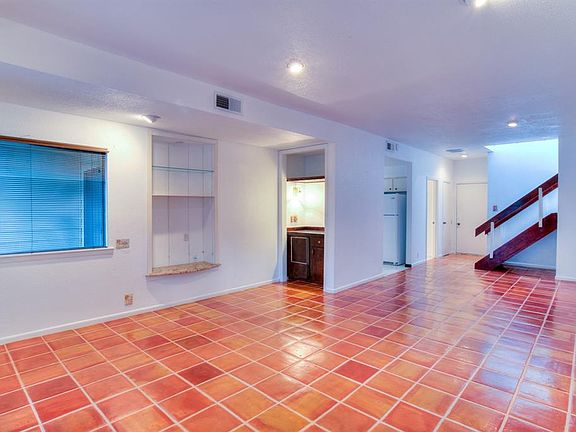 The living /dining area with entry to the kitchen, the laundry room and half bath, storage closet and door to the garage.