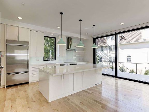Glass wall pulls the kitchen into the outside