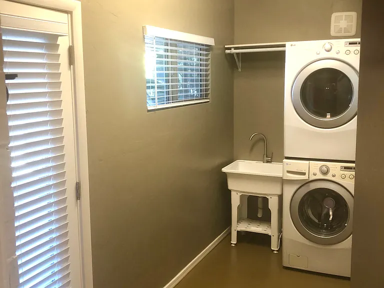 Door to Carport, Laundry sink with clothes rod to hang clothes out of the dryer or for drying wet items. laundry room exhaust fan