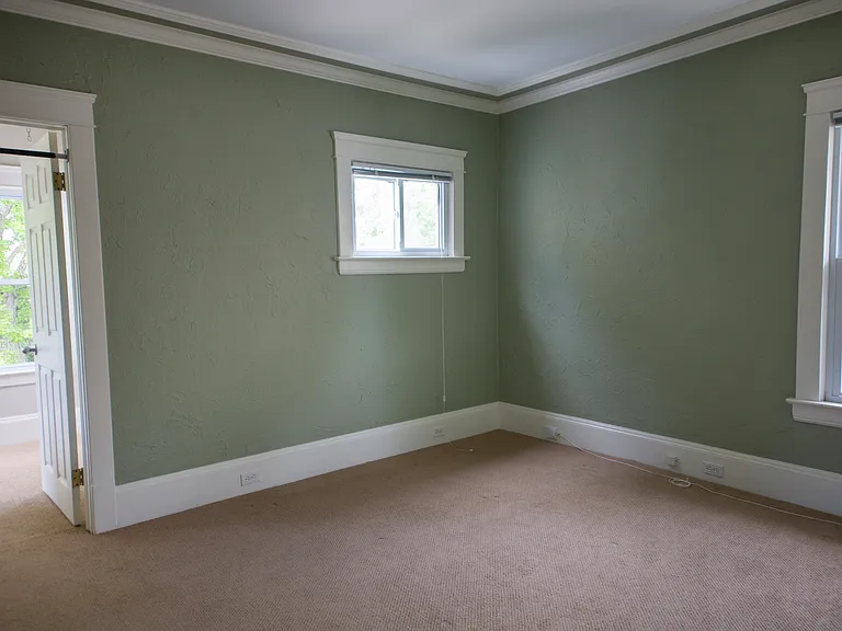 Comfortable secondary bedroom with classic Cleveland Heights charm and flexible layout options.