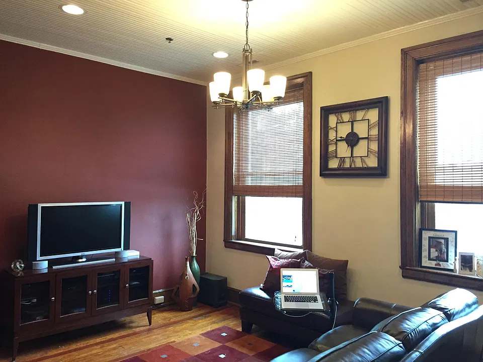 The entire condo features historic hardwoods, large double-pane windows and tons of charm.
