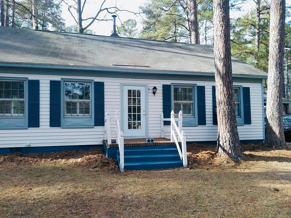 Step into this 4 bedroom beauty on a corner lot including wired storage, oversized deck, carport, and fence for privacy!