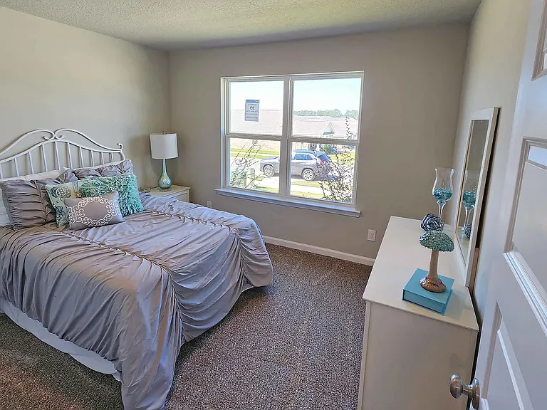 This bedroom overlooks the front yard and has a street view.
