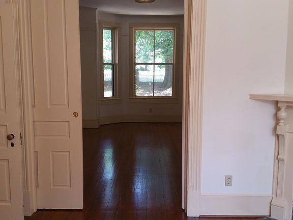 From dining room back to living room and front view, original pocket doors