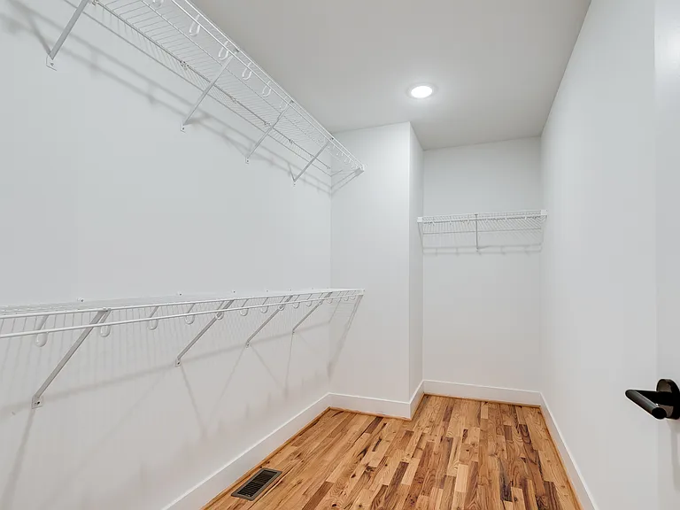 Primary bedroom walk-in closet