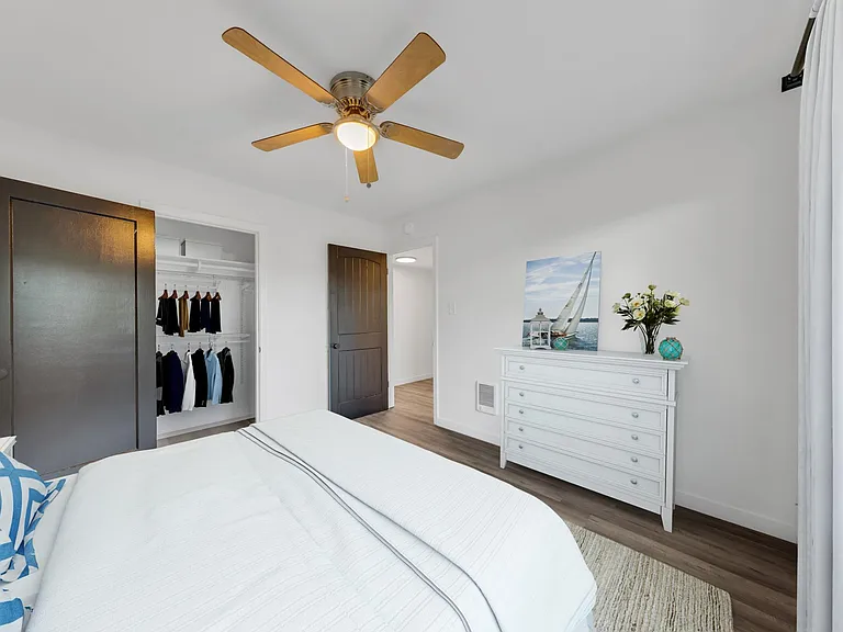 Second bedroom with closet organizer.