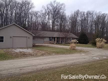 Front of House with Detached Garage
						:
						Few of house from road showing separate drives to house and garage.
